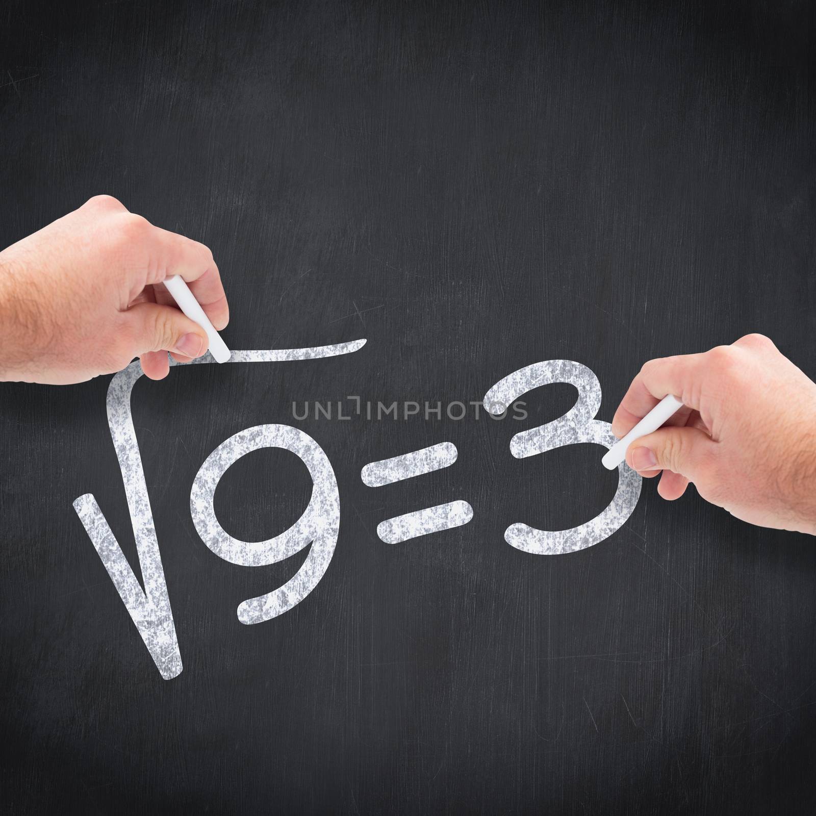 Business man writing with chalk against blackboard