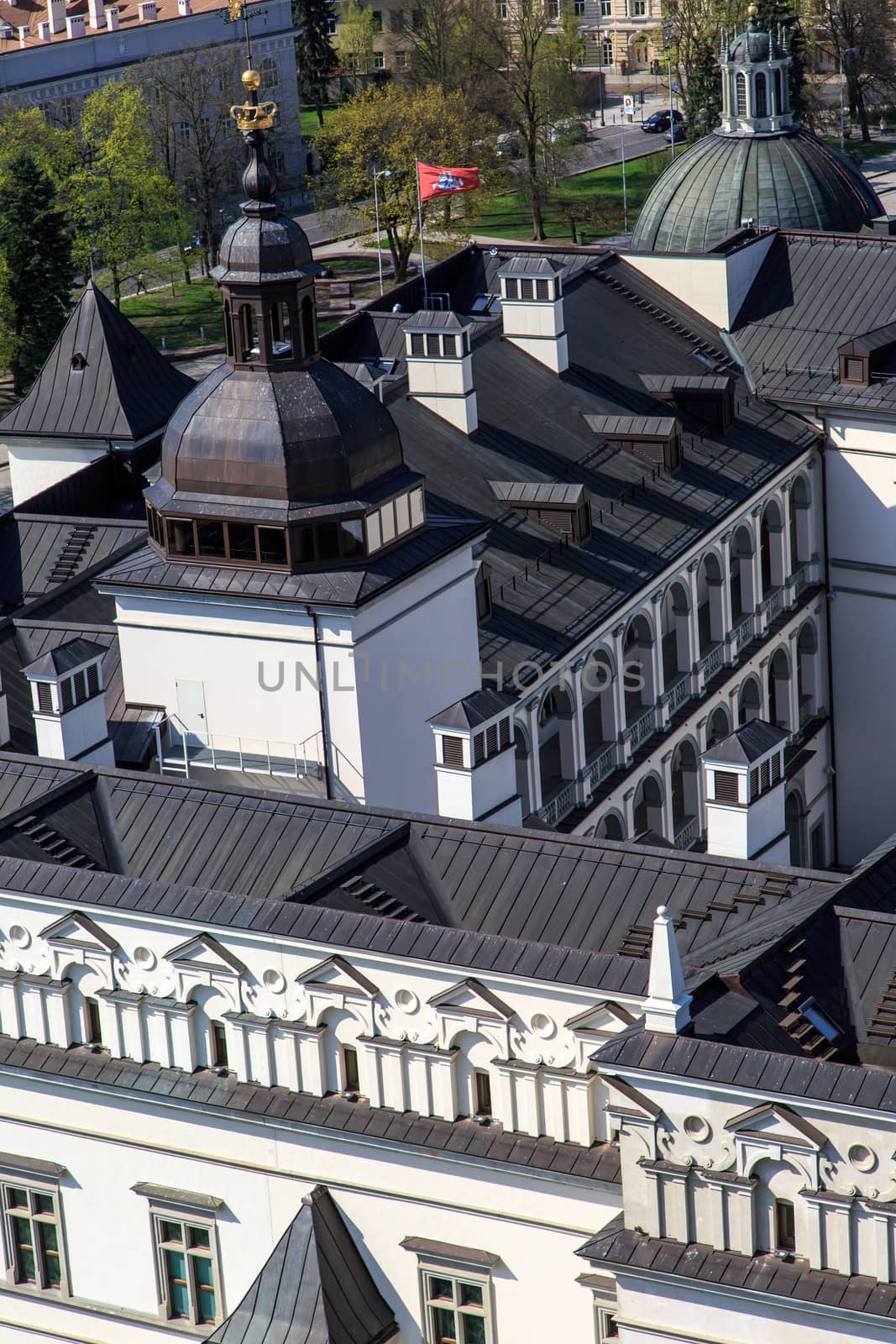 Close up detailed top view of historical architectural white building with black roof, in Vilnius, Lithuania.