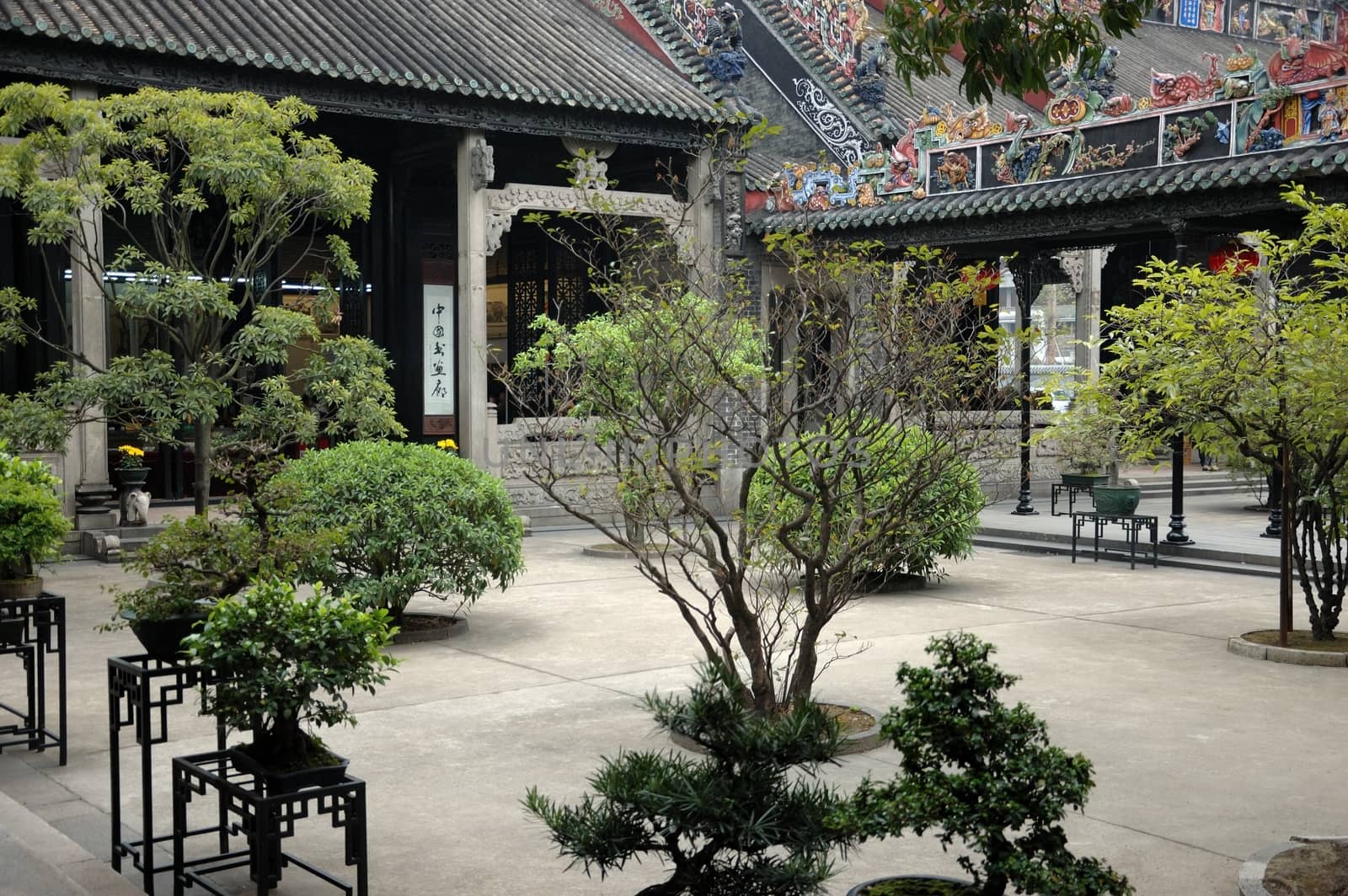 Chen Family Temple, traditional Chinese architecture in Guangzhou. Unique buildings and atriums with bonsai bushes.