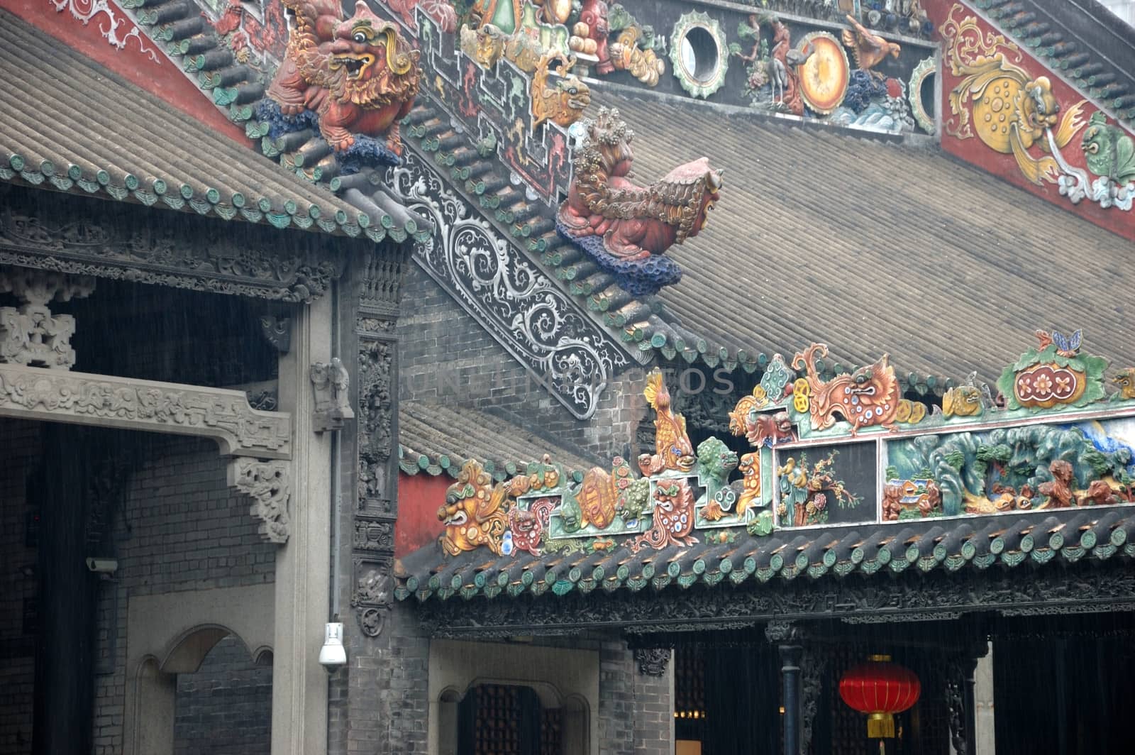 Historical roofs inside Chen Family Temple in Guangzhou, China. Roofs and colums with colorful decorations.
