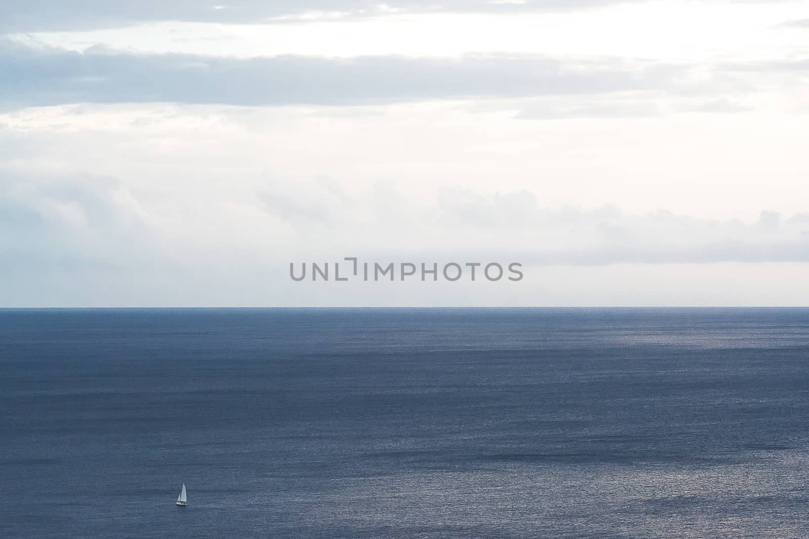 Sea and sky with sailboat in solitary