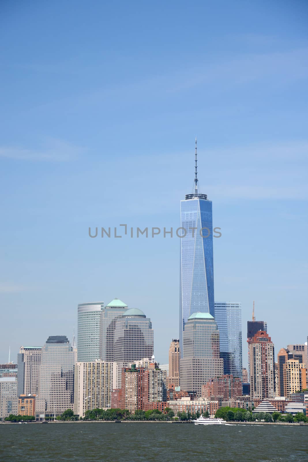 building and skyline of downtown manhattan during daytime as seen from a boat