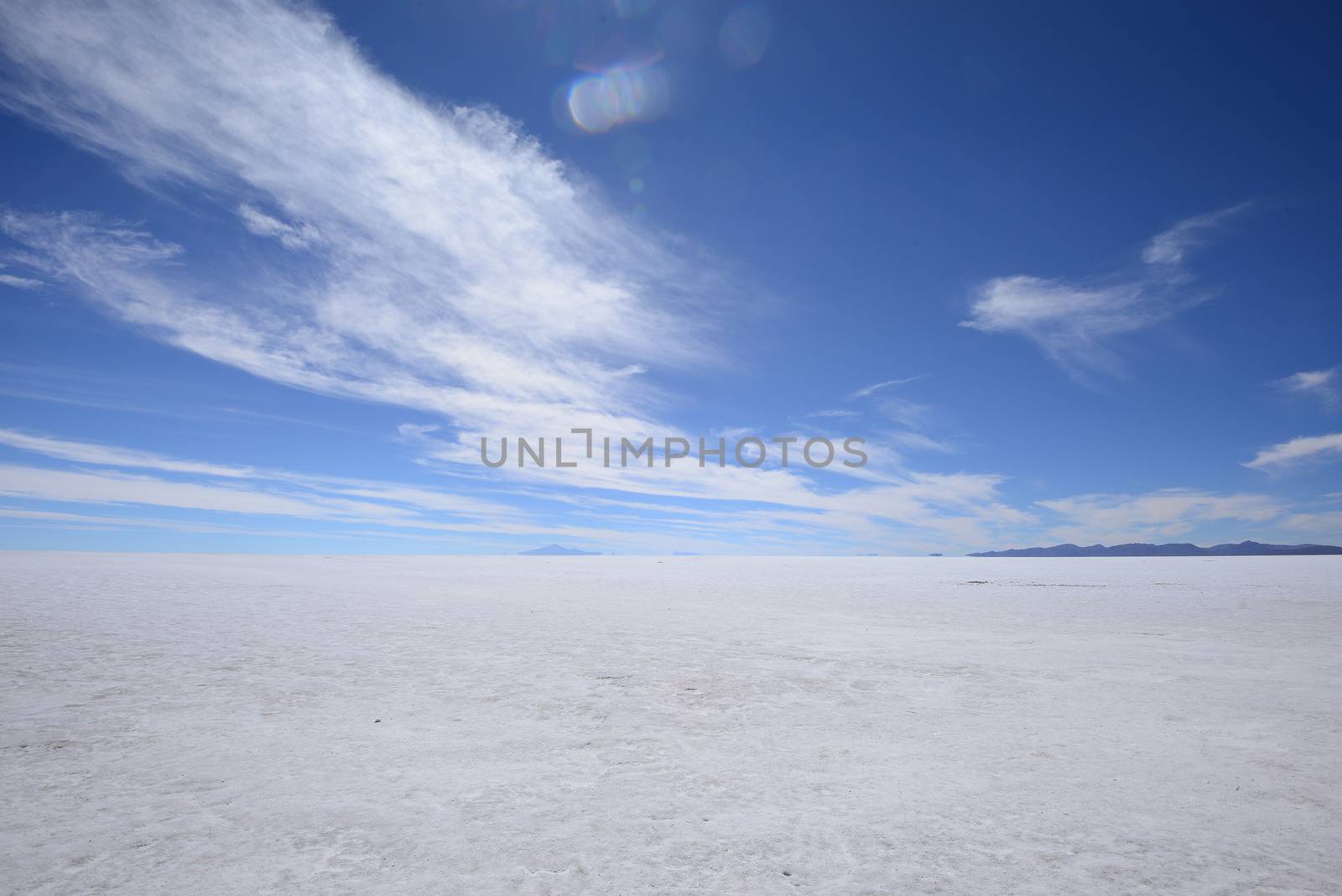 a surreal landscape of infinite view of salt flat in uyuni, bolivia