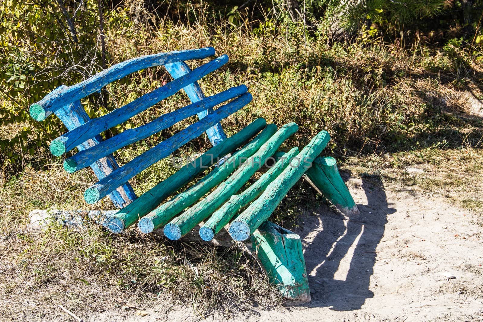 Unusual wooden bench handmade in a forest glade