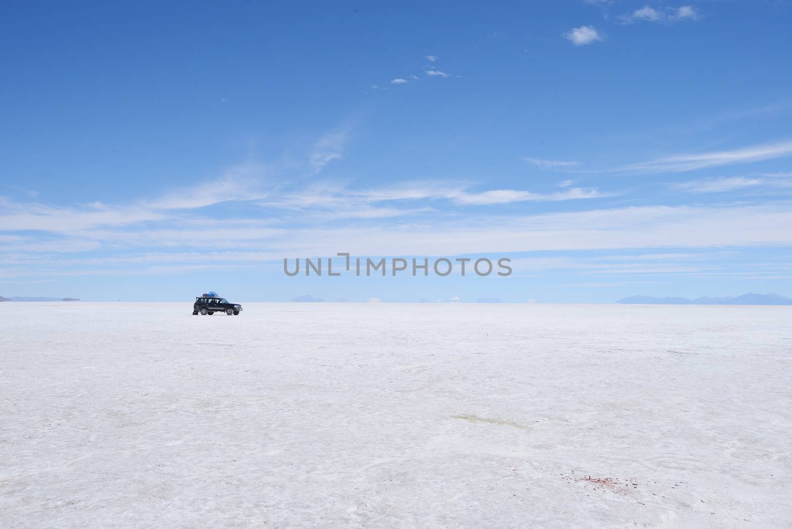 a surreal landscape of infinite view of salt flat in uyuni, bolivia