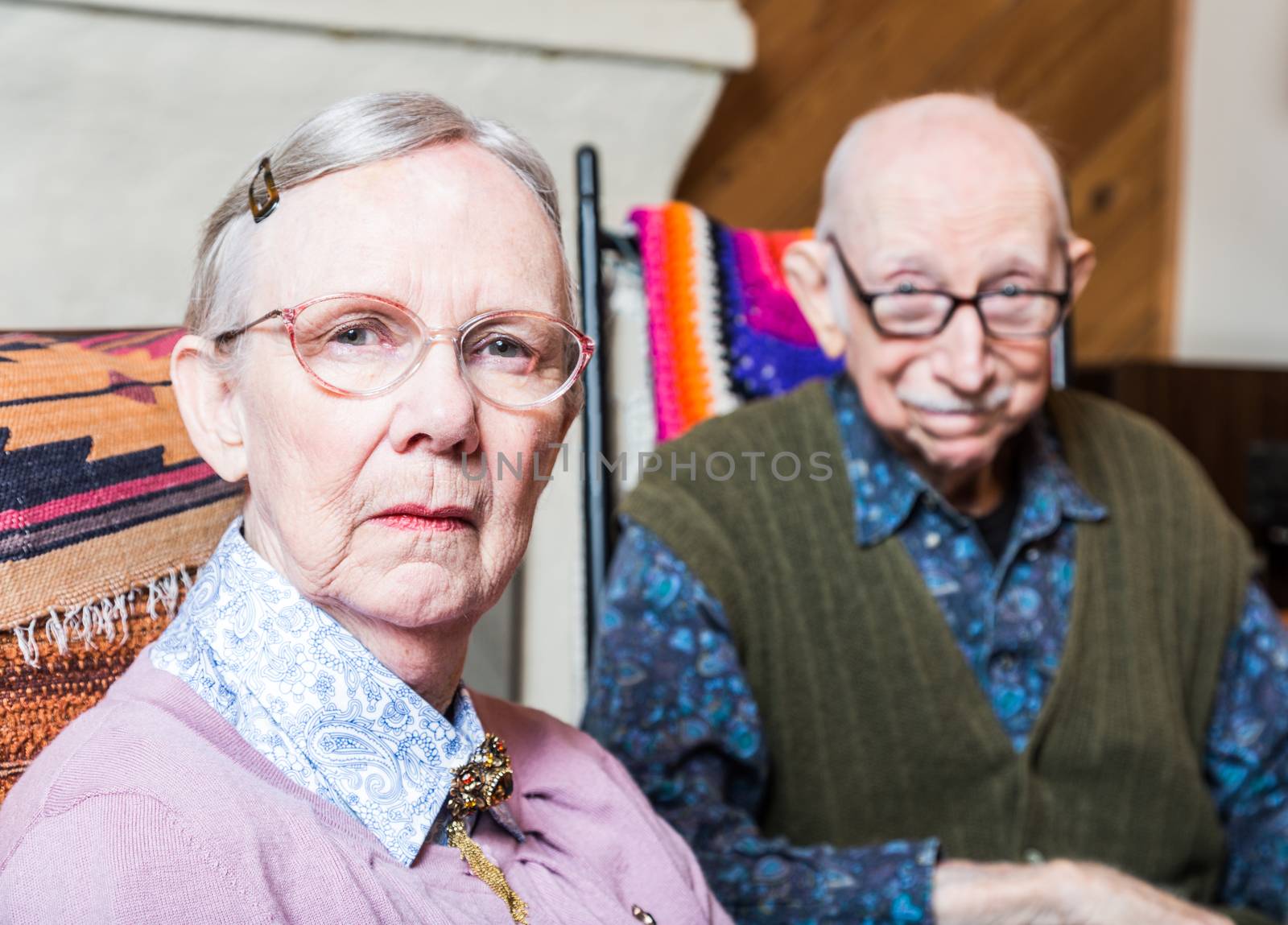 Old woman and man looking at camera skeptically