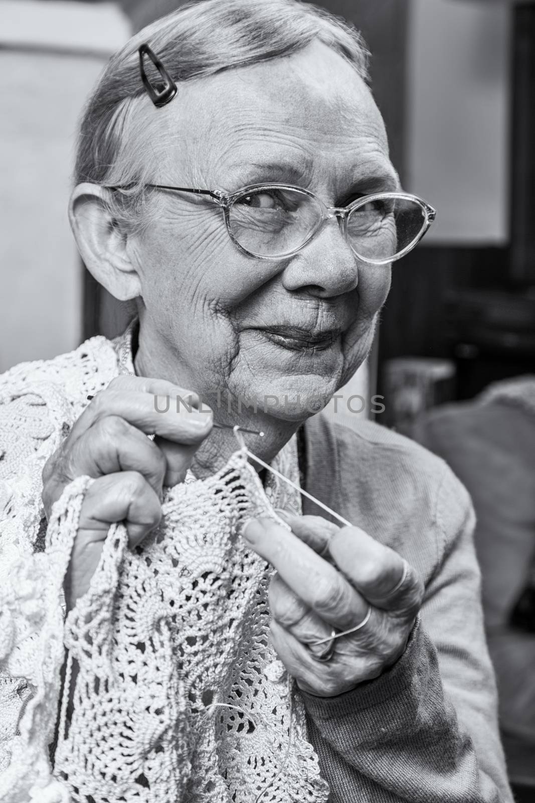 Happy Elderly Woman with Crochet by Creatista