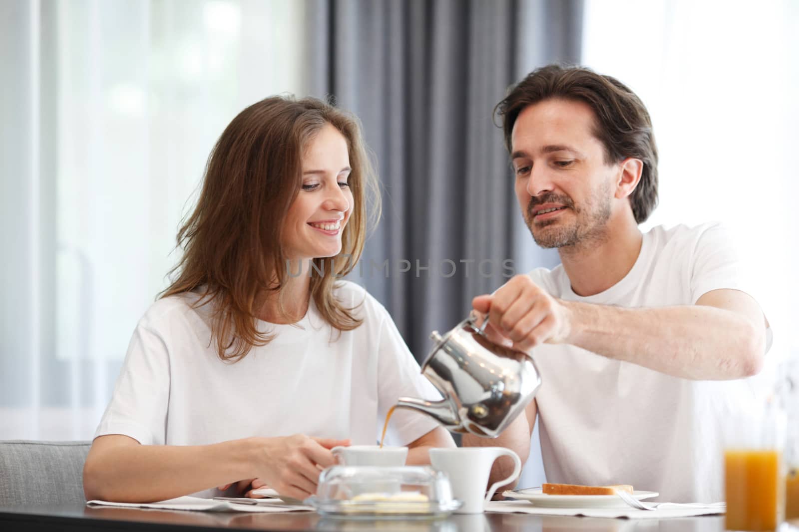 couple eating breakfast by ALotOfPeople