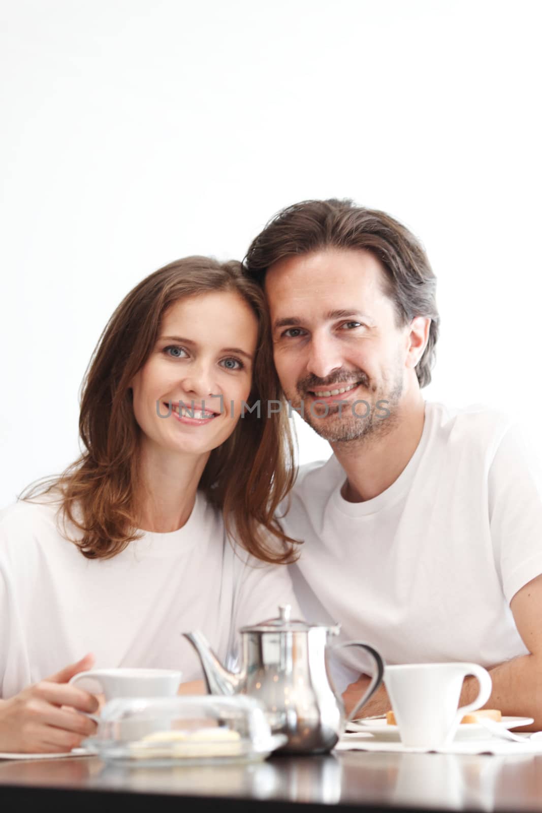 couple eating breakfast at kitchen