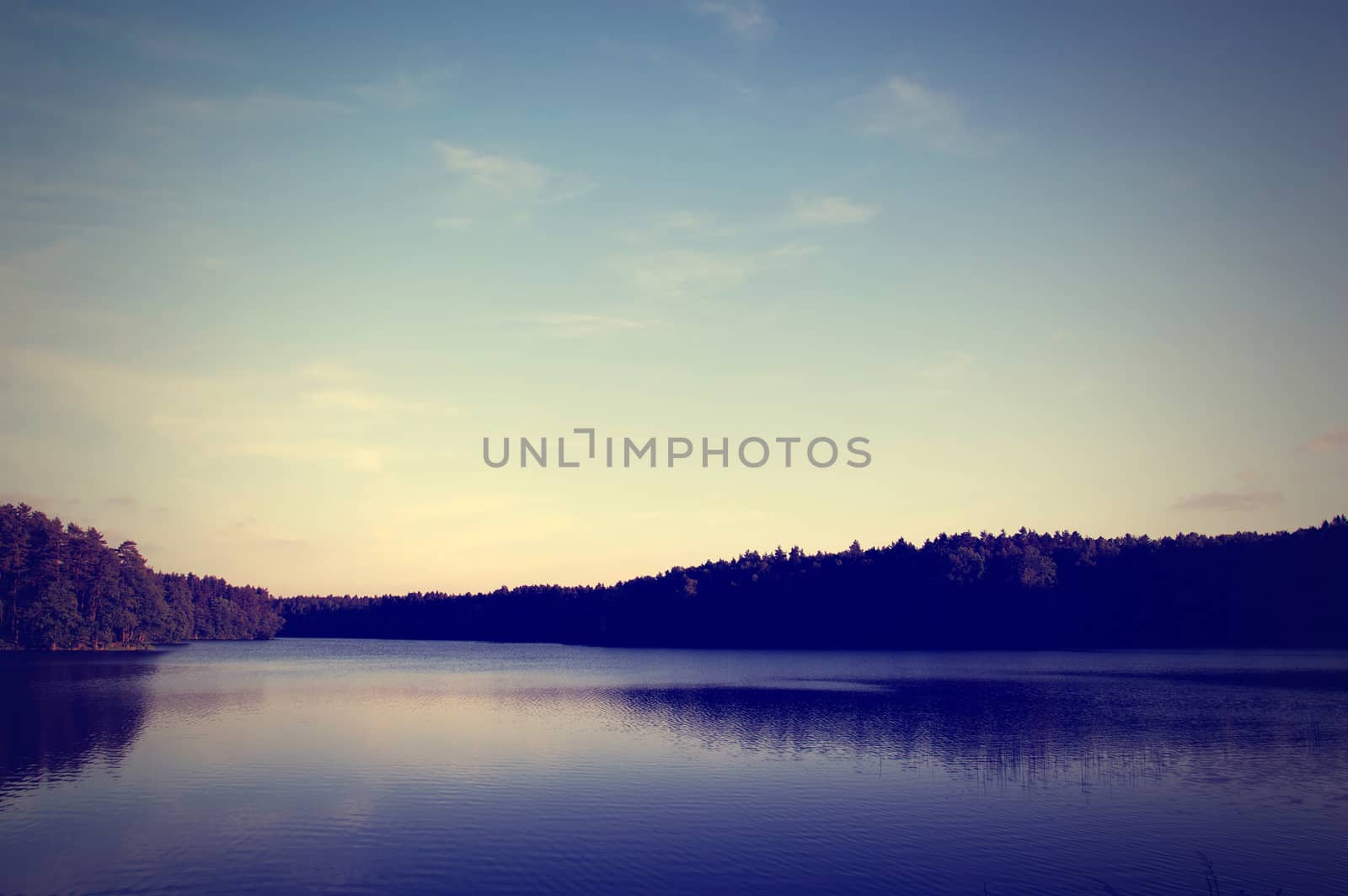 Nature conceptual image. Evening on the lake at summer. Instagram vintage picture.