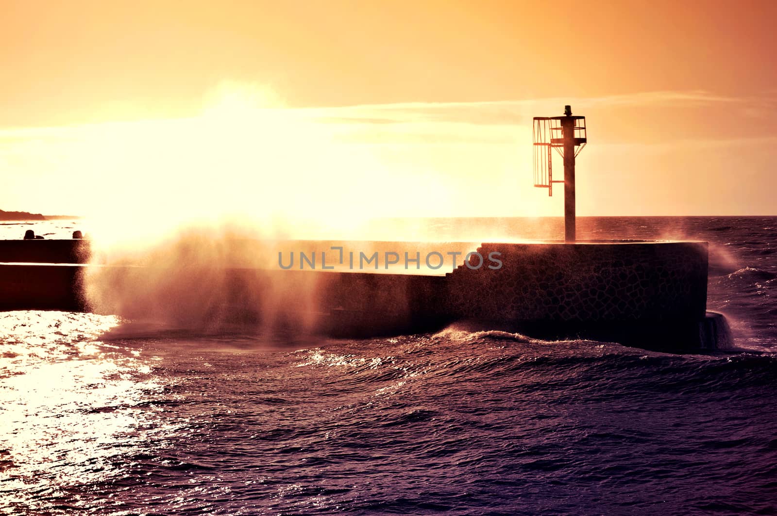 Coast and nature. Sunset over storm on the sea. 