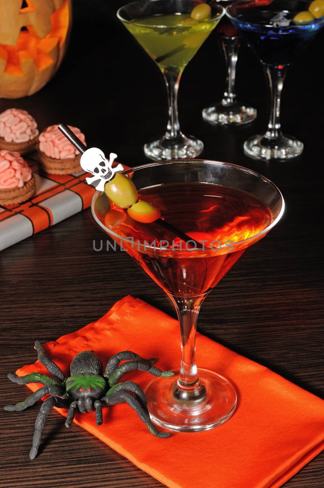 Cocktail with olives straw decorated with a skull