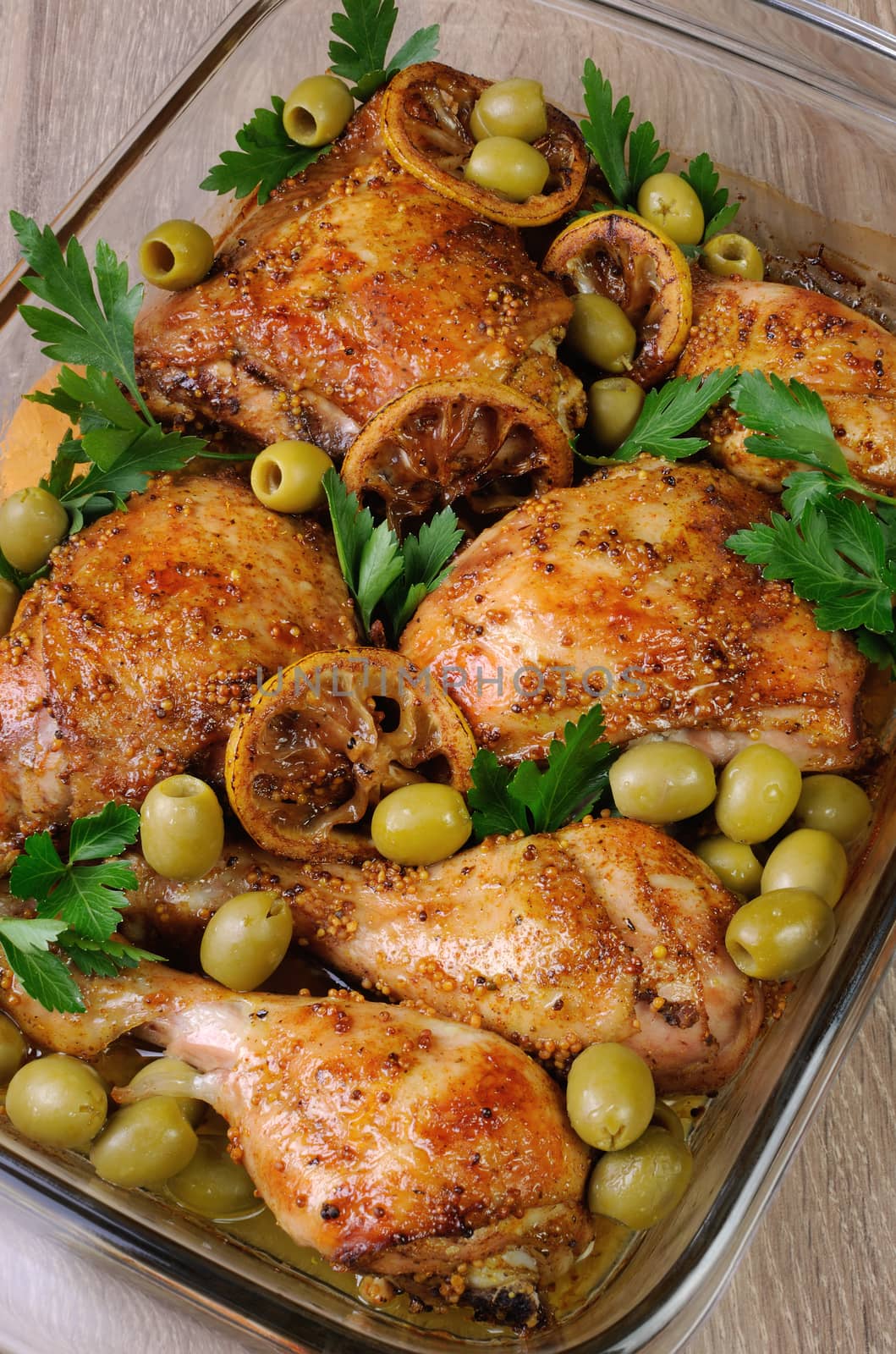 parts of chicken baked with olives marinated in lemon