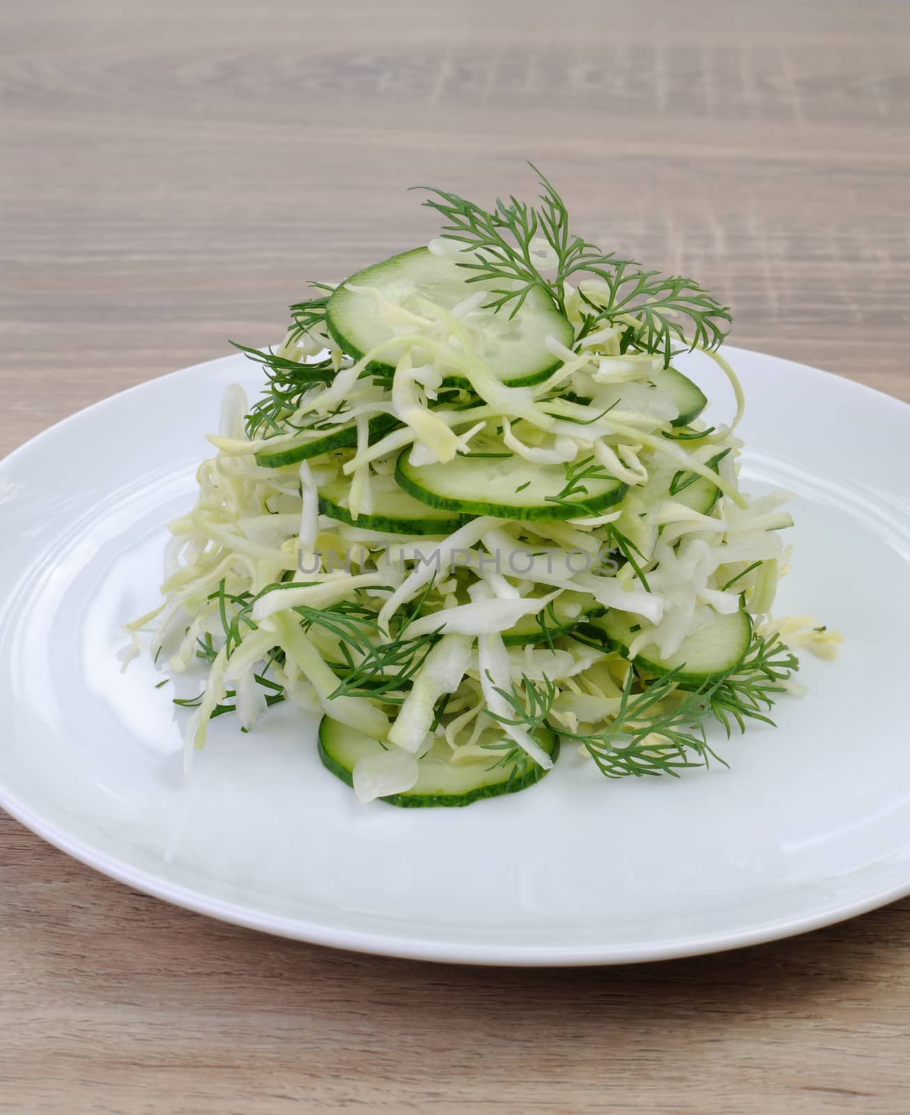 Salad  finely chopped cabbage   with cucumber and dill