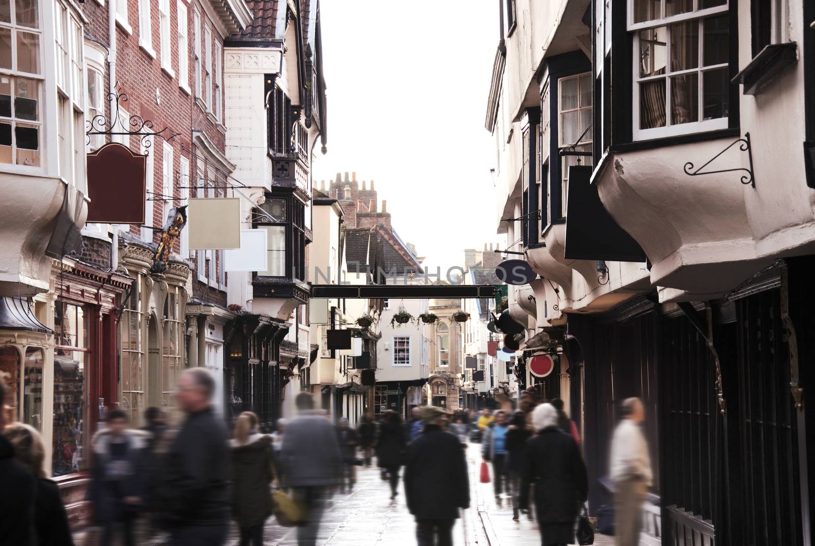 England. Crowd on old english streets of York town.