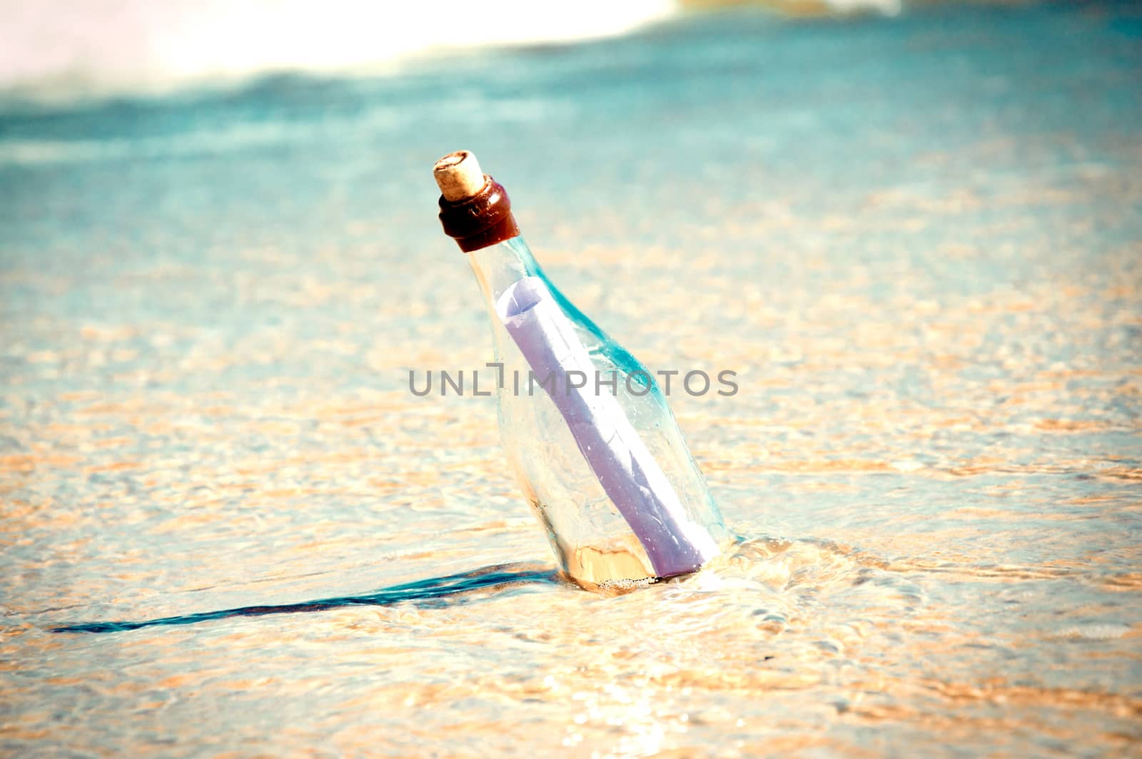 Bottle with a message. Beach and ocean.