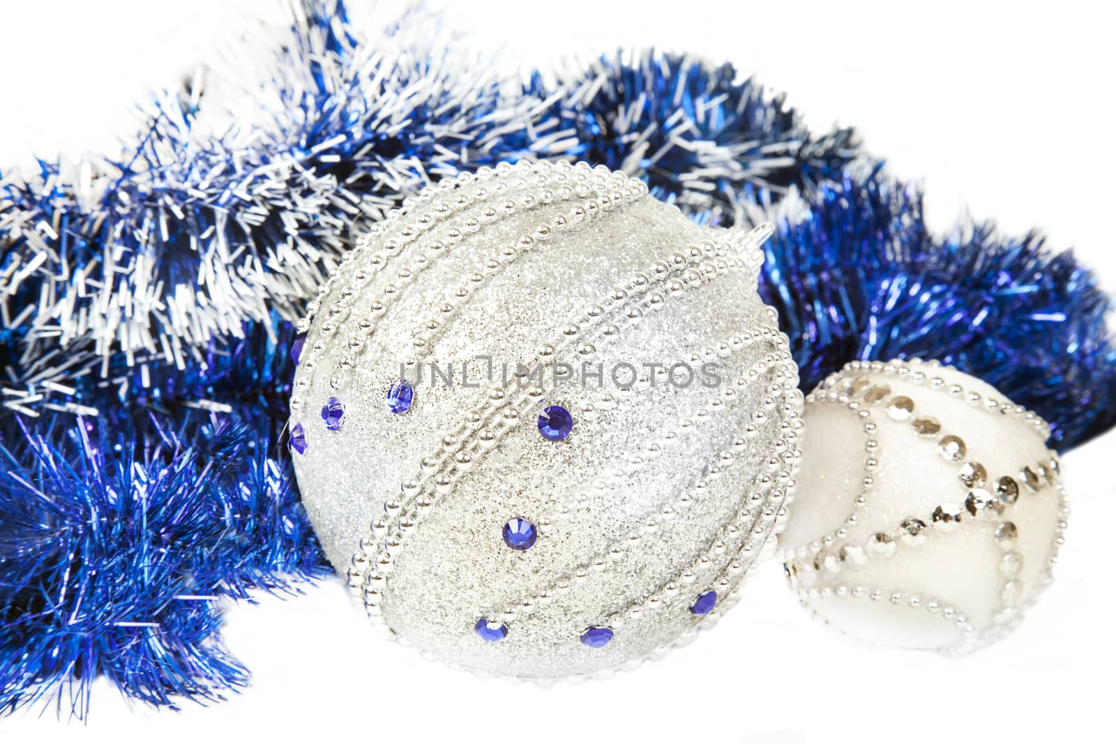 Christmas blue tinsel and blue with white glitter balls isolated