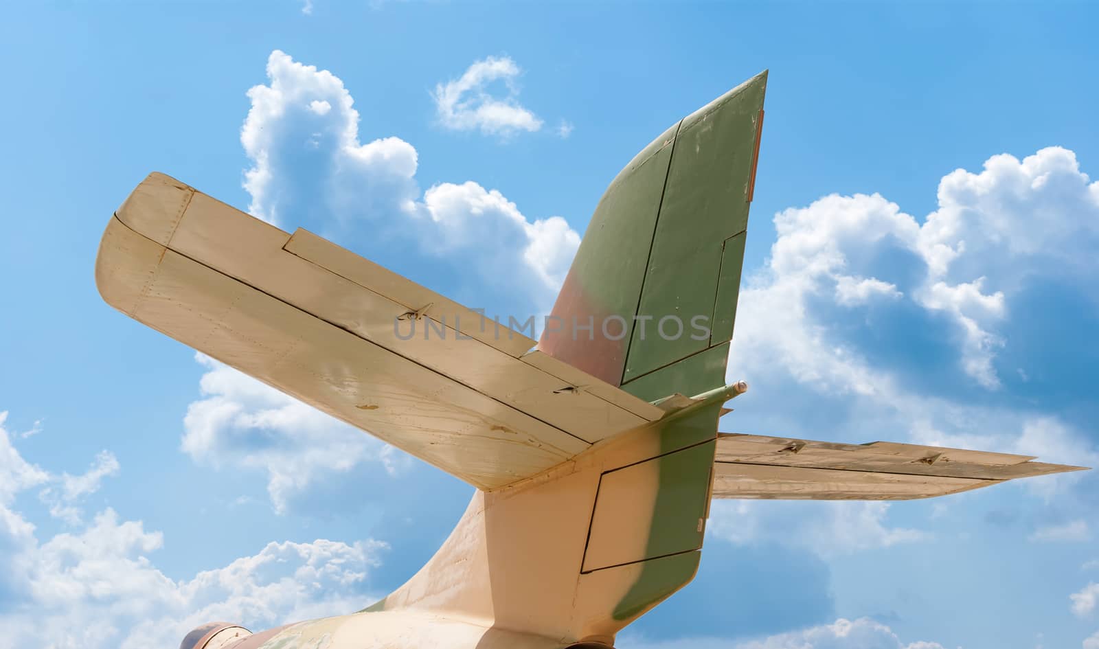 Tail section of a aircraft, blue sky background