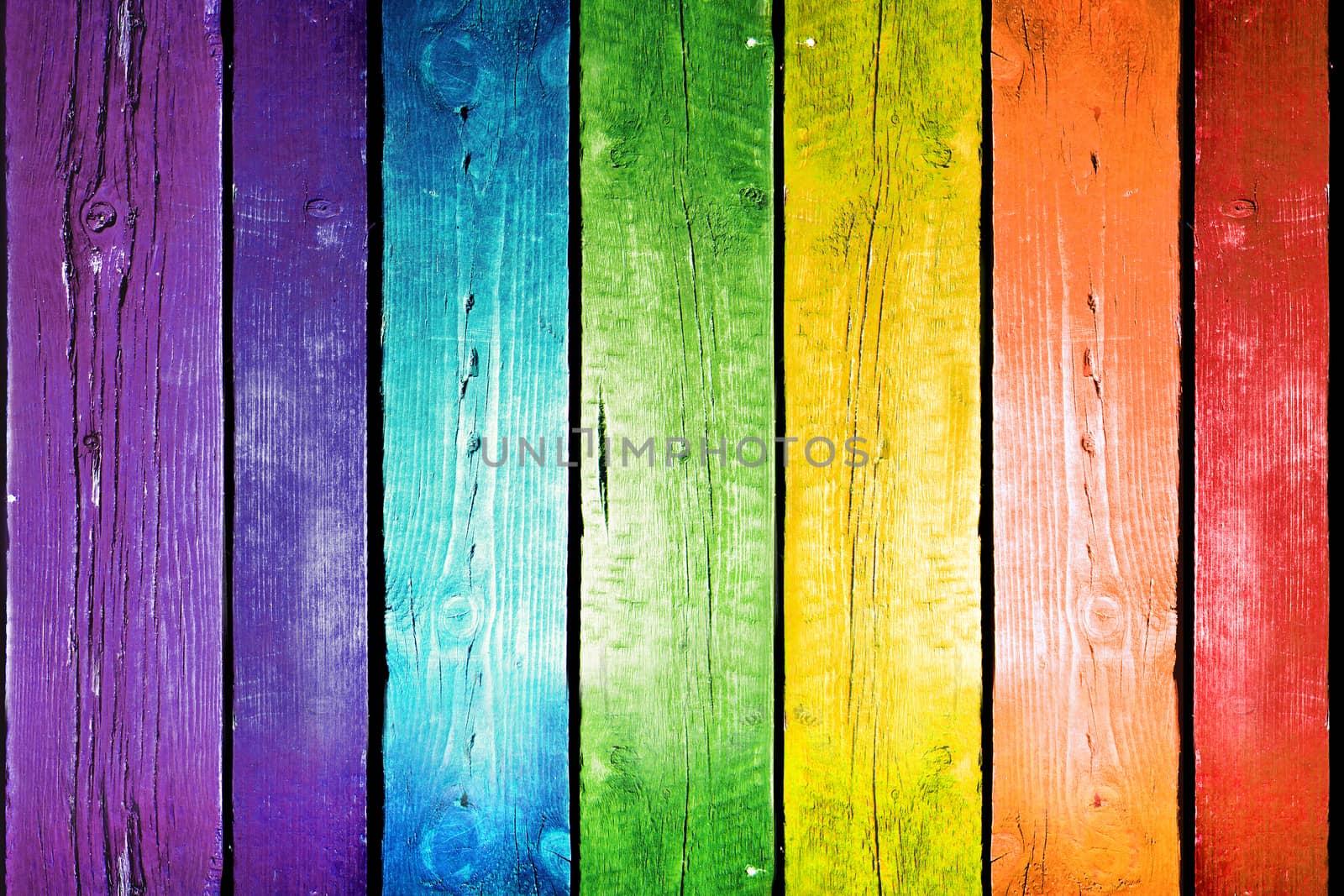 Planks in the colors of the rainbow. Colorful wood background.