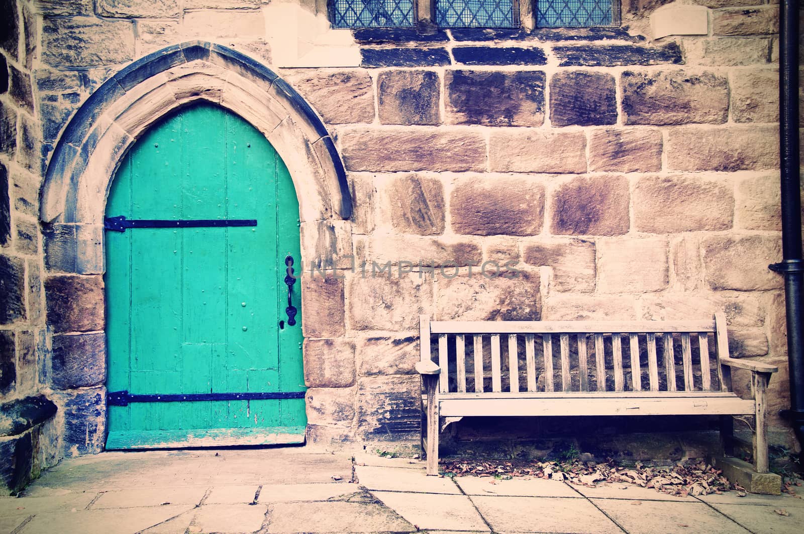 Old doors and bench in creamy pastel vintage picture.