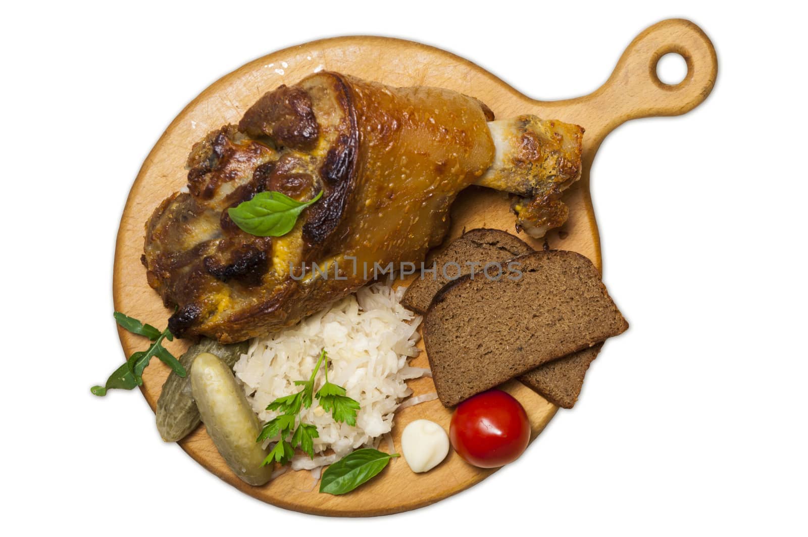 Roasted pork leg (rulka) served with sauerkraut, view from above, isolated on white