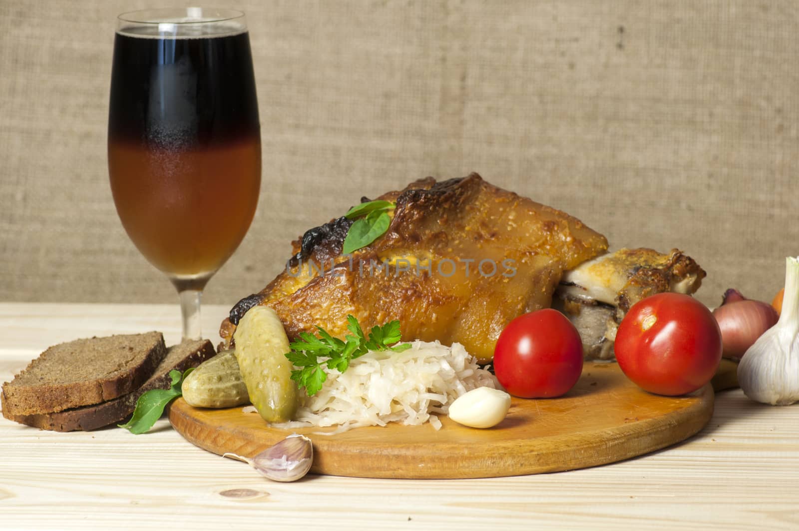 Roasted pork leg served with sauerkraut and sliced beer by dred