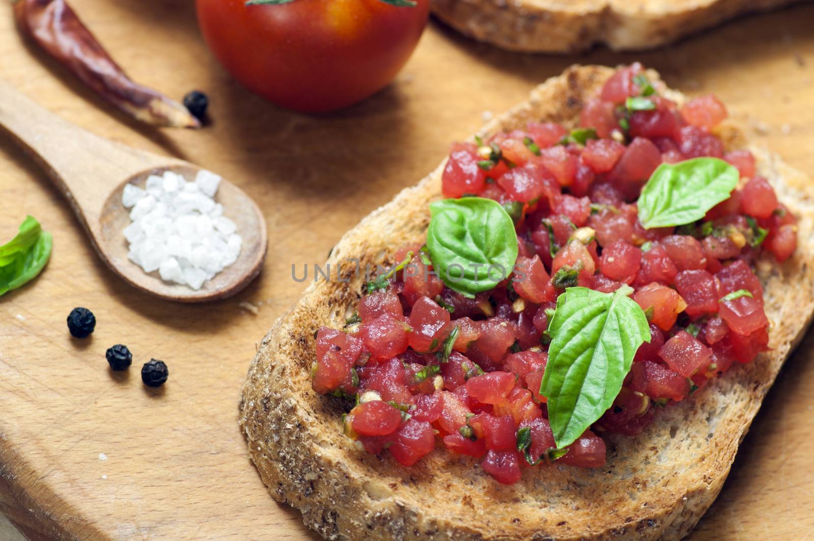 Italian bruschetta topped with tomatoes and basil