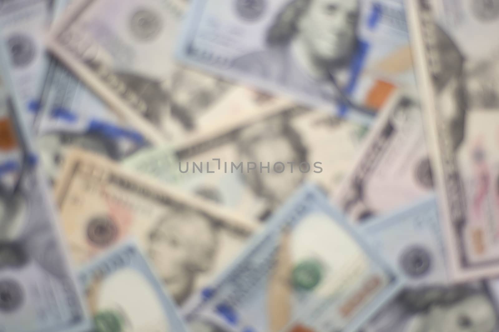 Blurred background made of various dollar bills