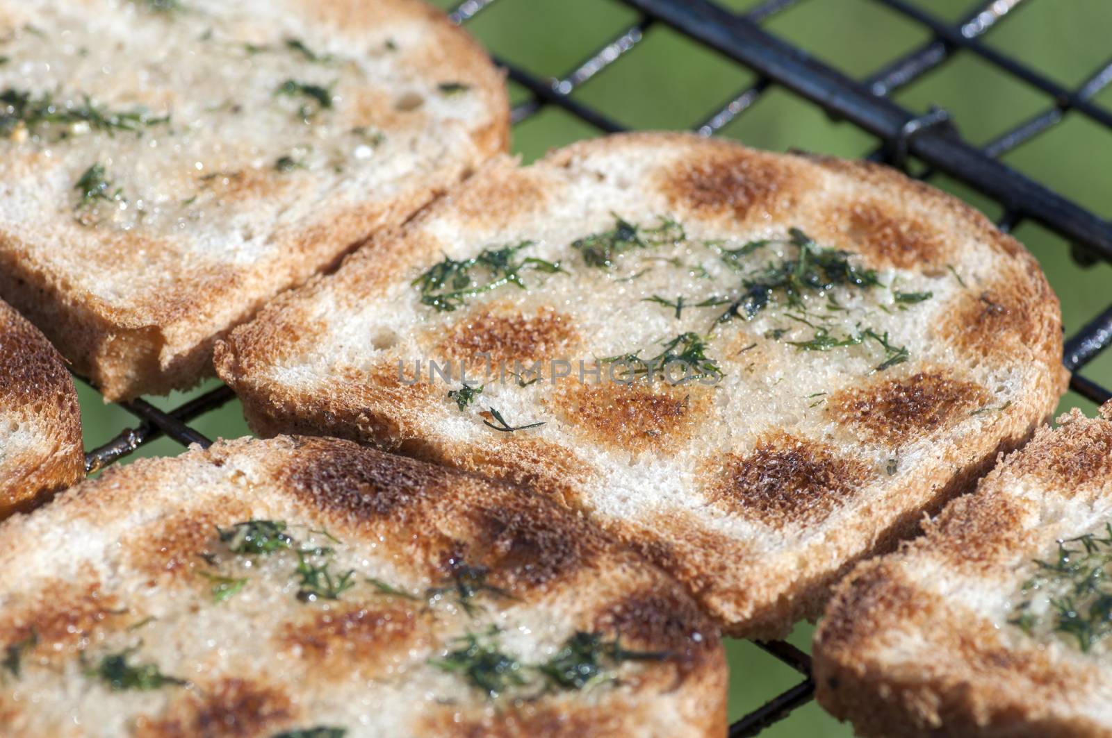 Grilled bruschetta with olive oil and rubbed with garlic