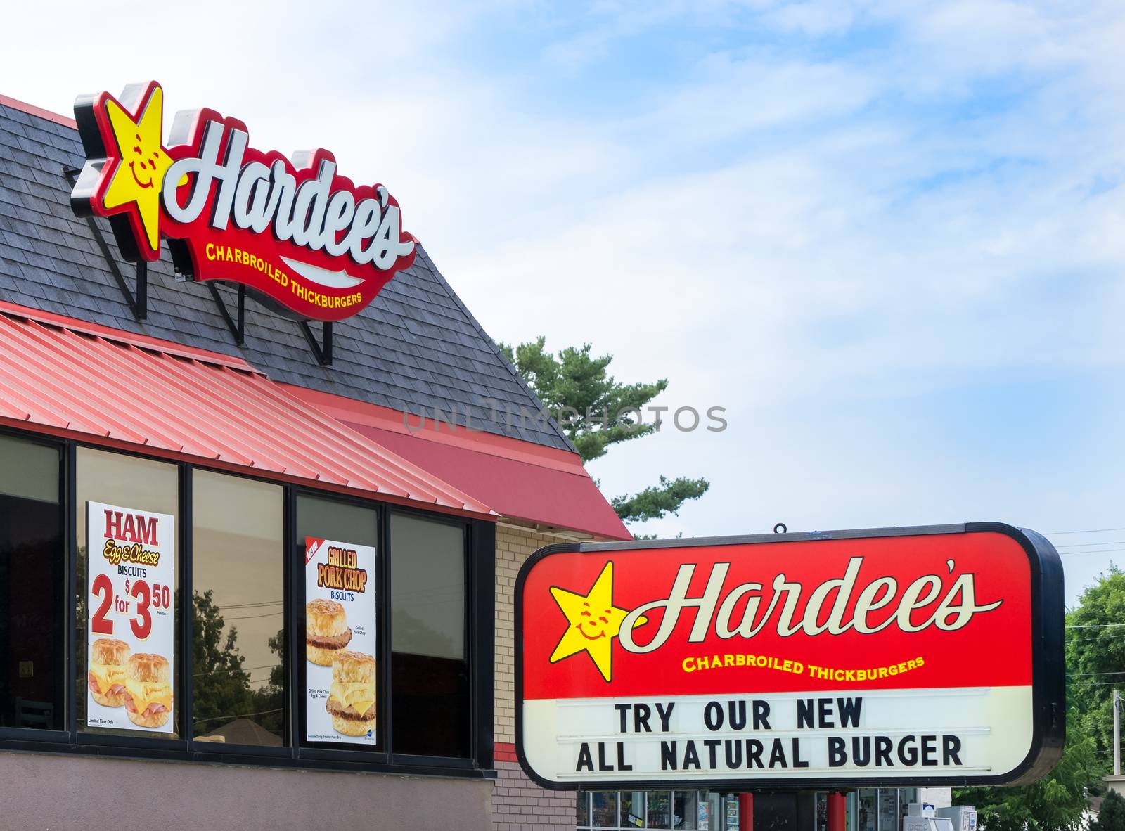GRINNELL, IA/USA - AUGUST 8, 2015: Hardee's restaurant exterior and sign. Hardee's Food Systems, Inc., is an American fast-food restaurant chain.
