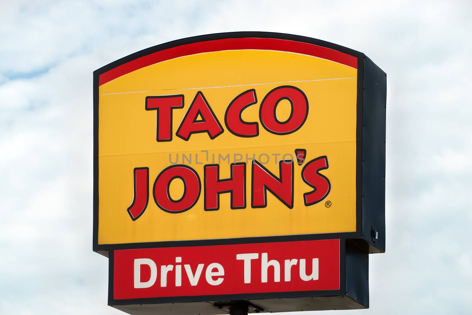 GRINNELL, IA/USA - AUGUST 8, 2015: Taco John's exterior and sign. Taco John's is fast-food restaurant featuring Mexican-inspired fast-food.