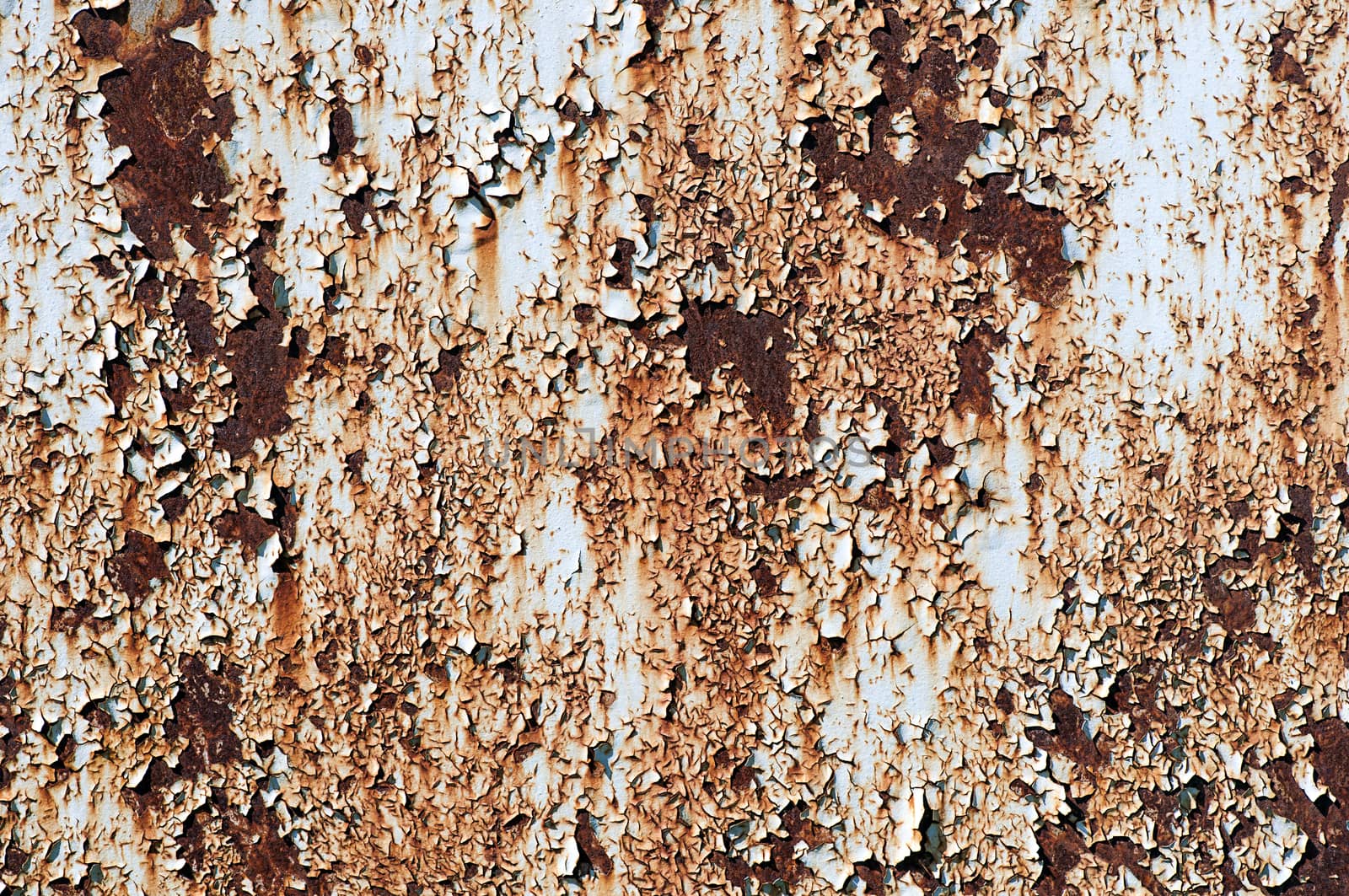 Rusted metallic surface with flaky paint