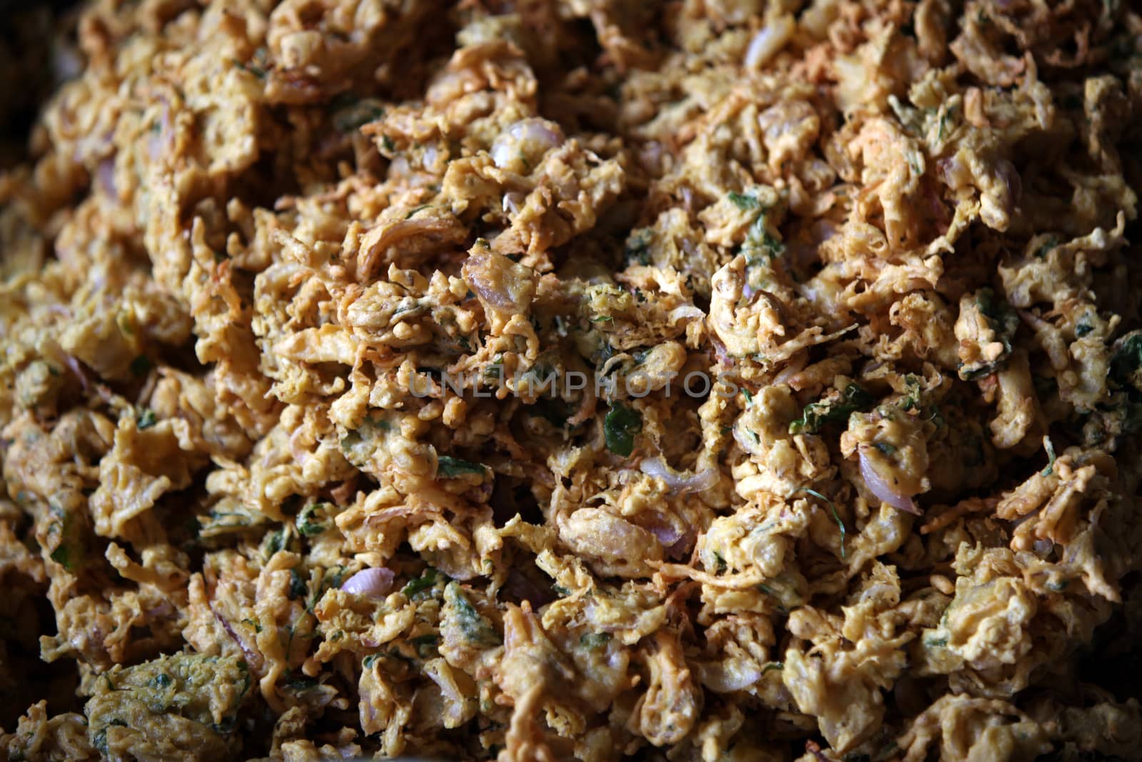 A background of delicious favorite Indian delicacy called Kanda Bhaji which are Onion Pakodas