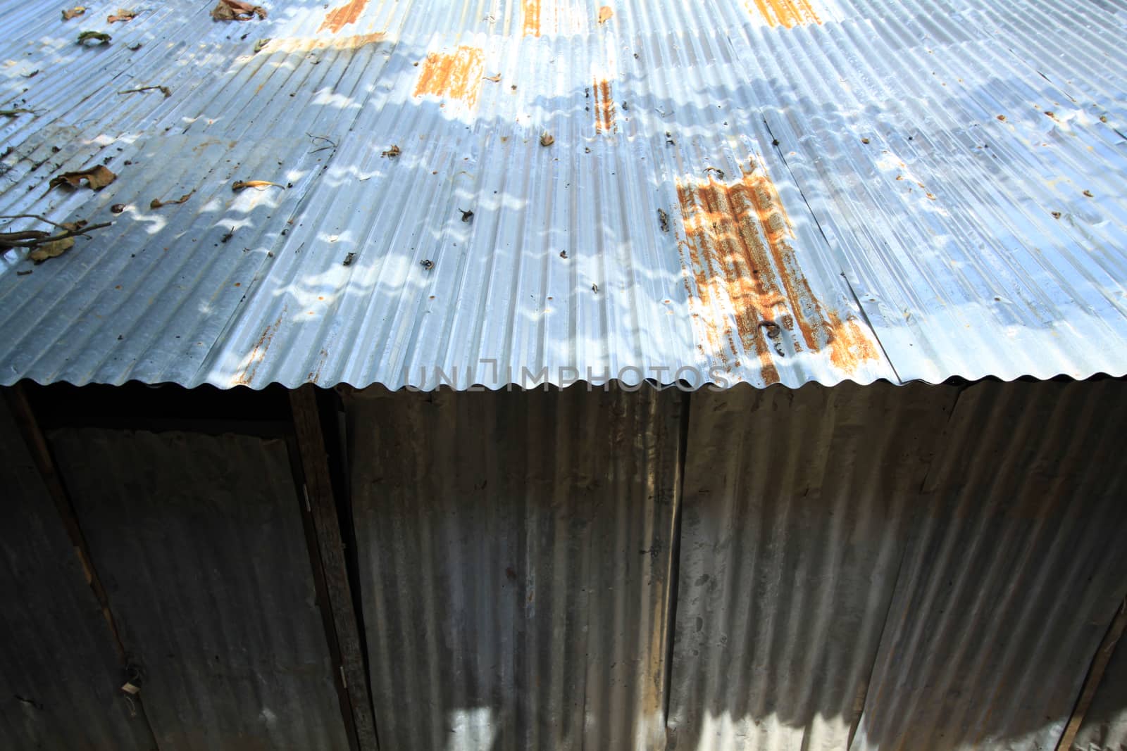 A rusty corrugated iron metal texture by kritsada1992