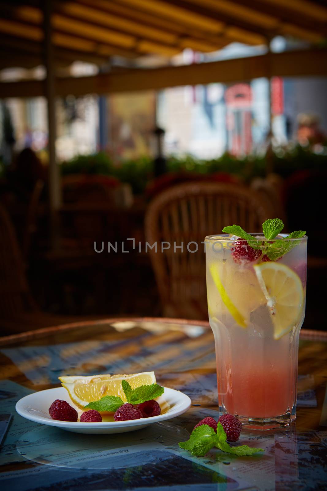 Refreshing homemade lemonade with raspberries and french mint