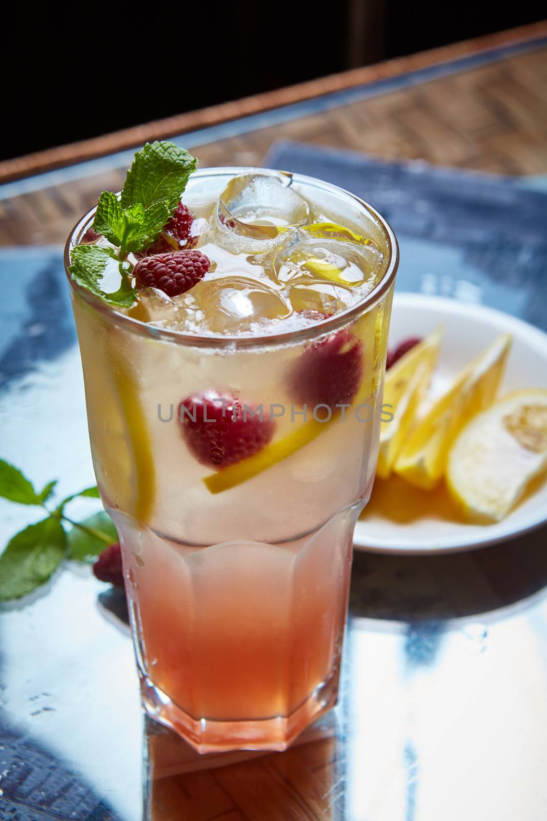 Refreshing homemade lemonade with raspberries and french mint