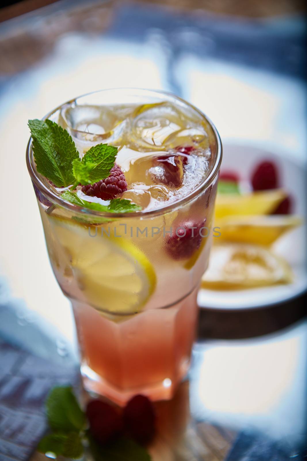 Refreshing homemade lemonade with raspberries and french mint