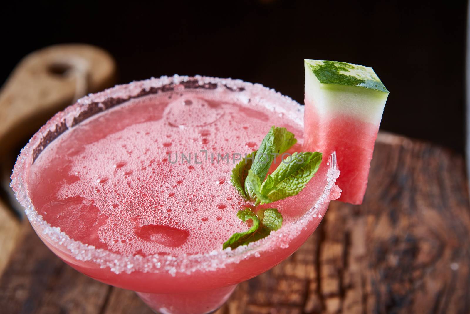 Watermelon frozen cocktail with copy space on wooden background