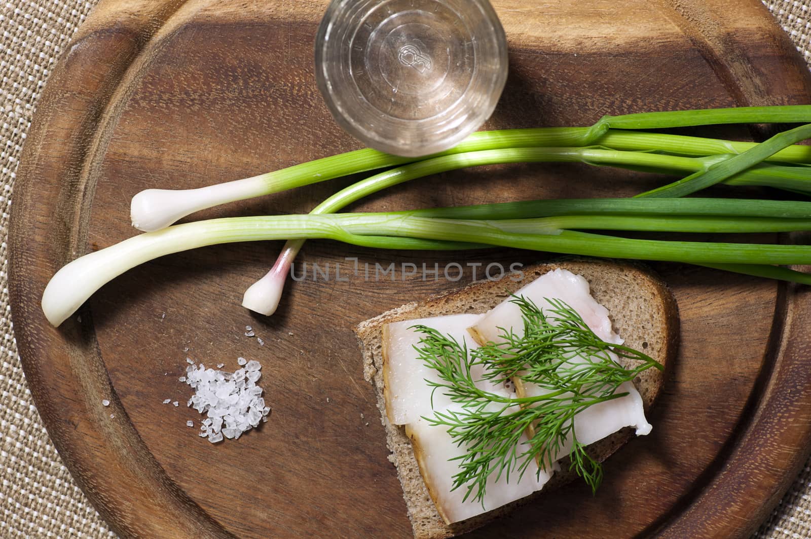 Sandwich with salted lard on rye bread and vodka view from above