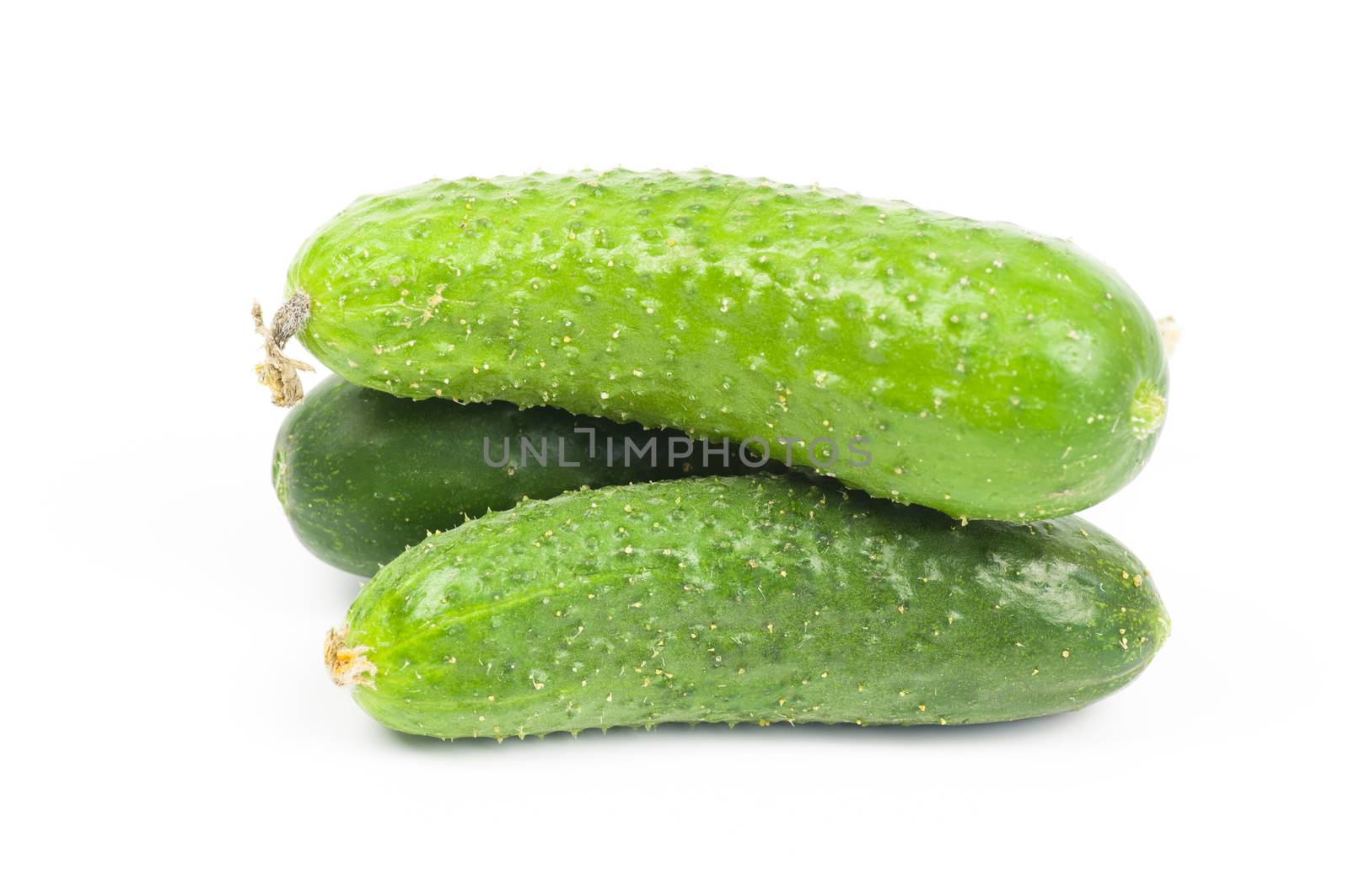 Ripe organic cucumber close up isolated on white