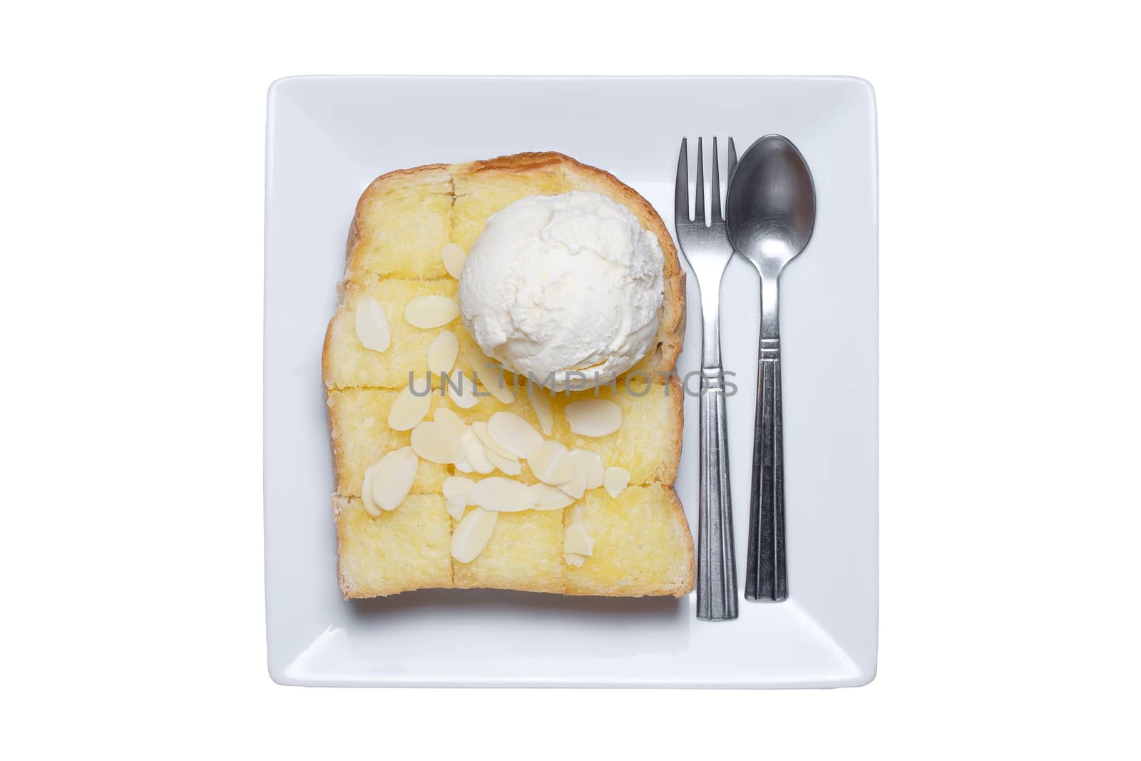 ice cream and almond slice on toast. All of it put on white ceramic dish. Isolate white background