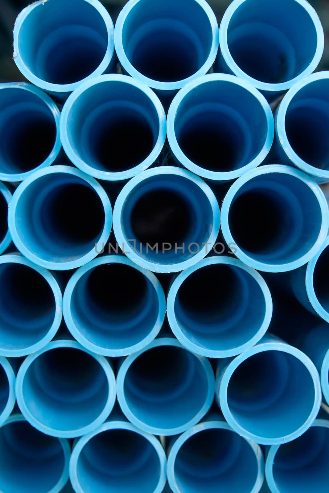 Group of blue pipe pvc in stock.