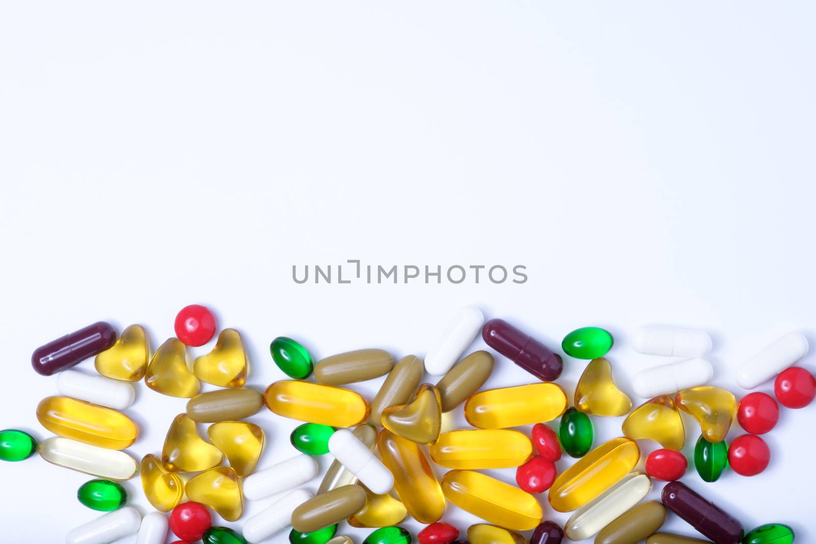 pills of vitamin and medicine on white background by zneb076