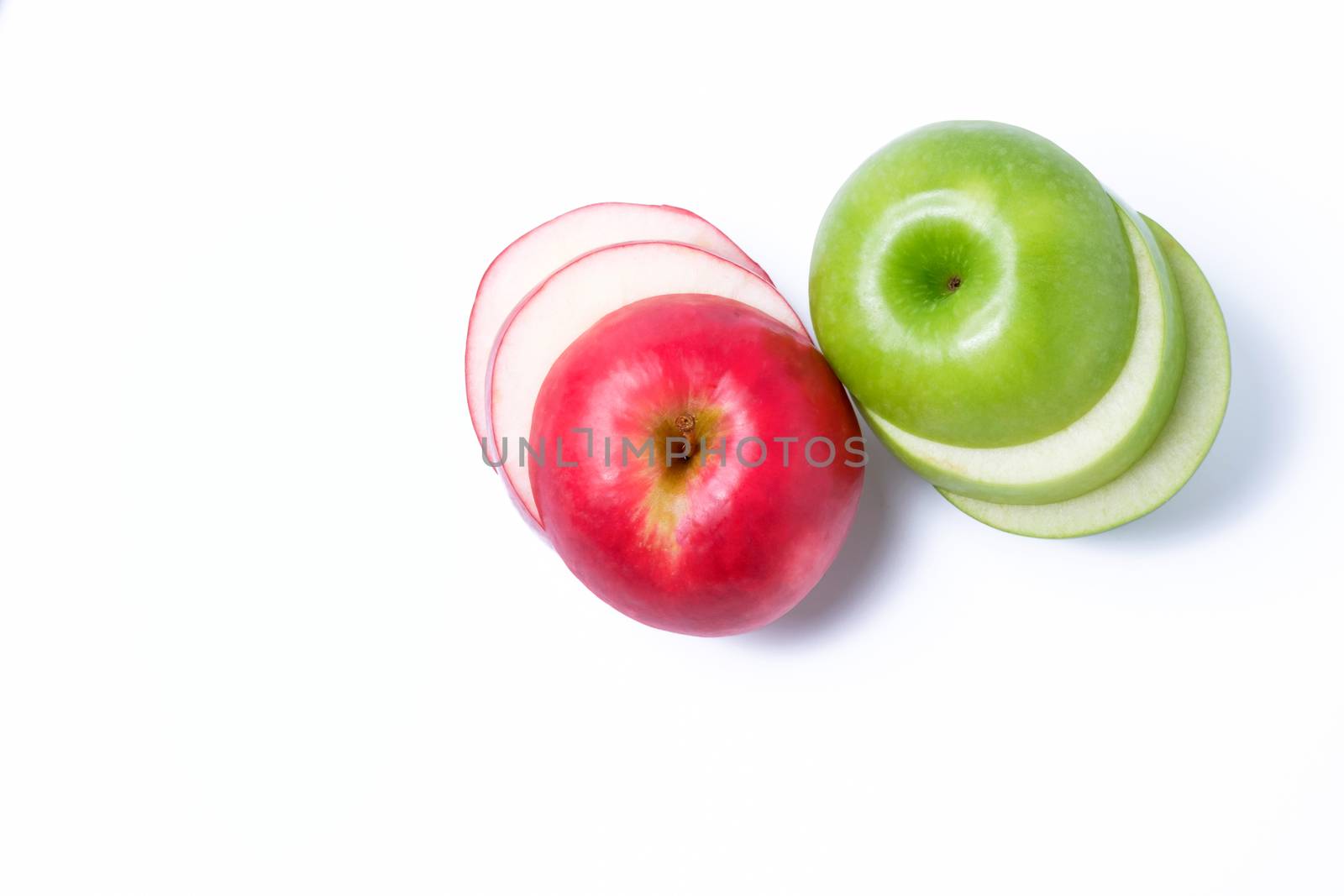 Slice red and green apples on whte background