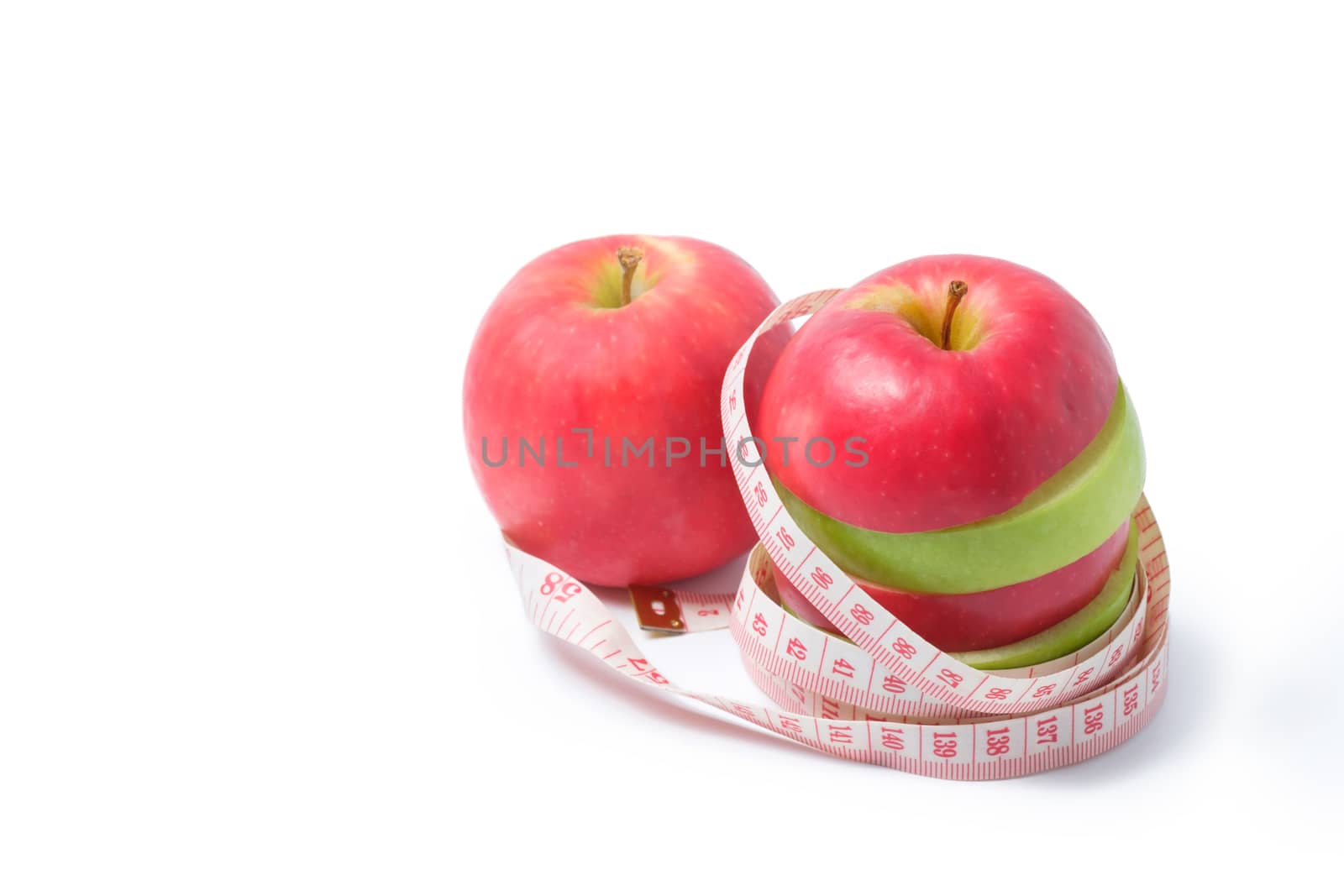 slice red and green apples with waist measure on white background.space for adding your text.
