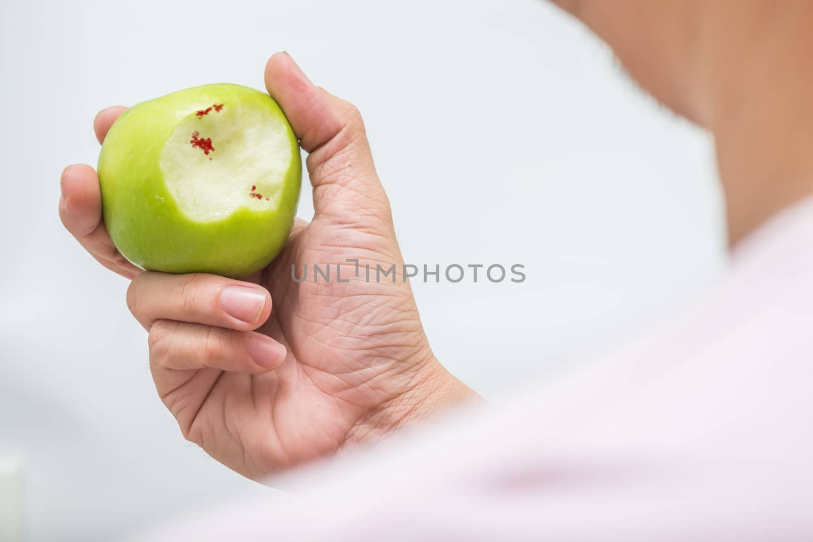 Asian man bite green apple and scurvy by zneb076