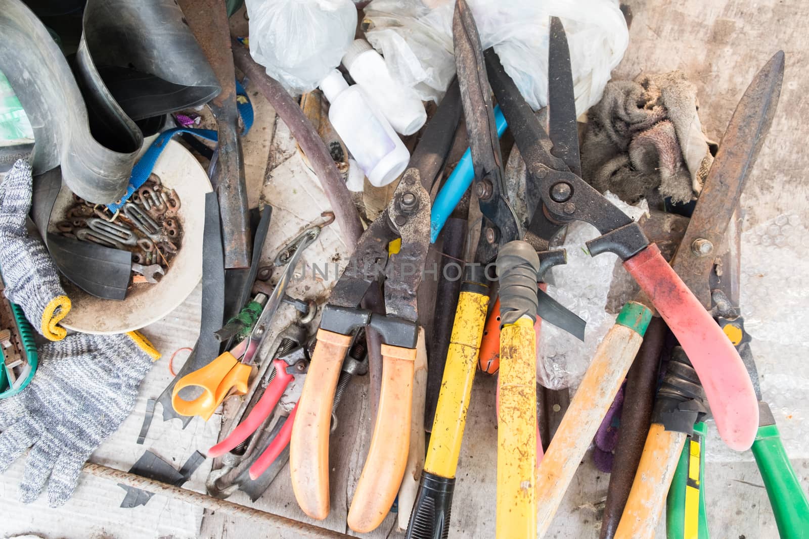 Garden tools on working table , it looked unordered and duty.