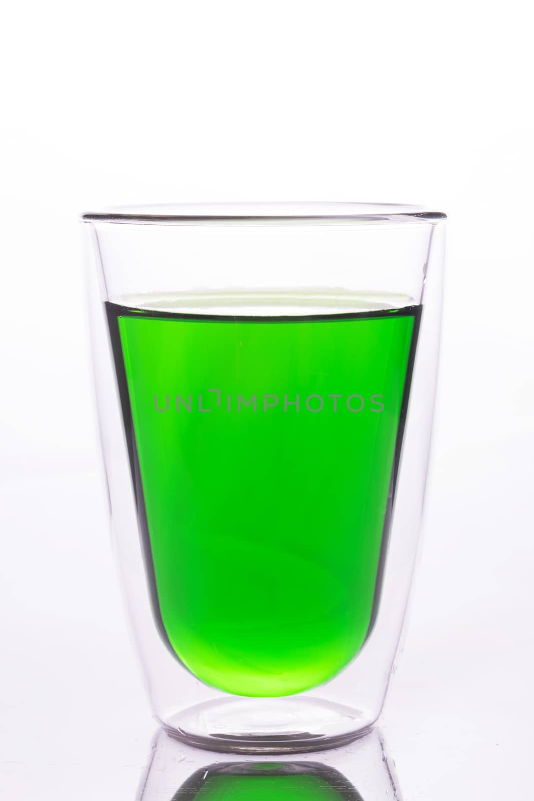 Glass of green water, look like a vegetable juice, soft drink