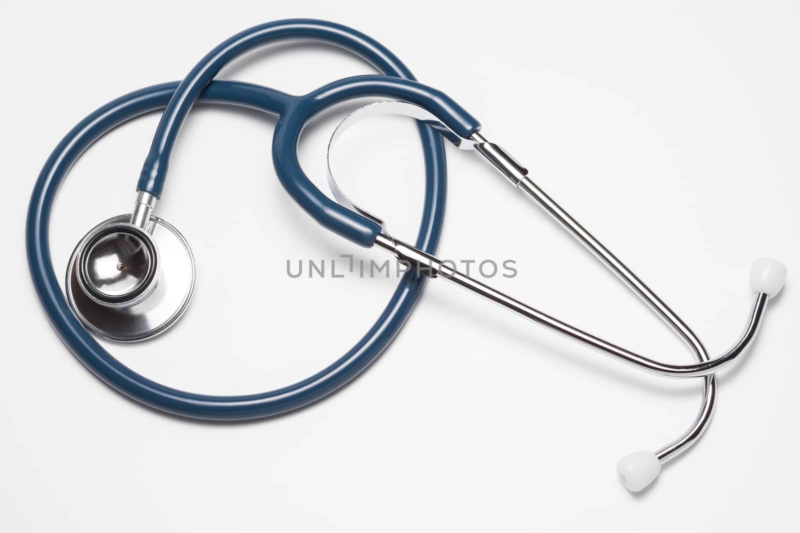 Blue stethoscope on white background by zneb076