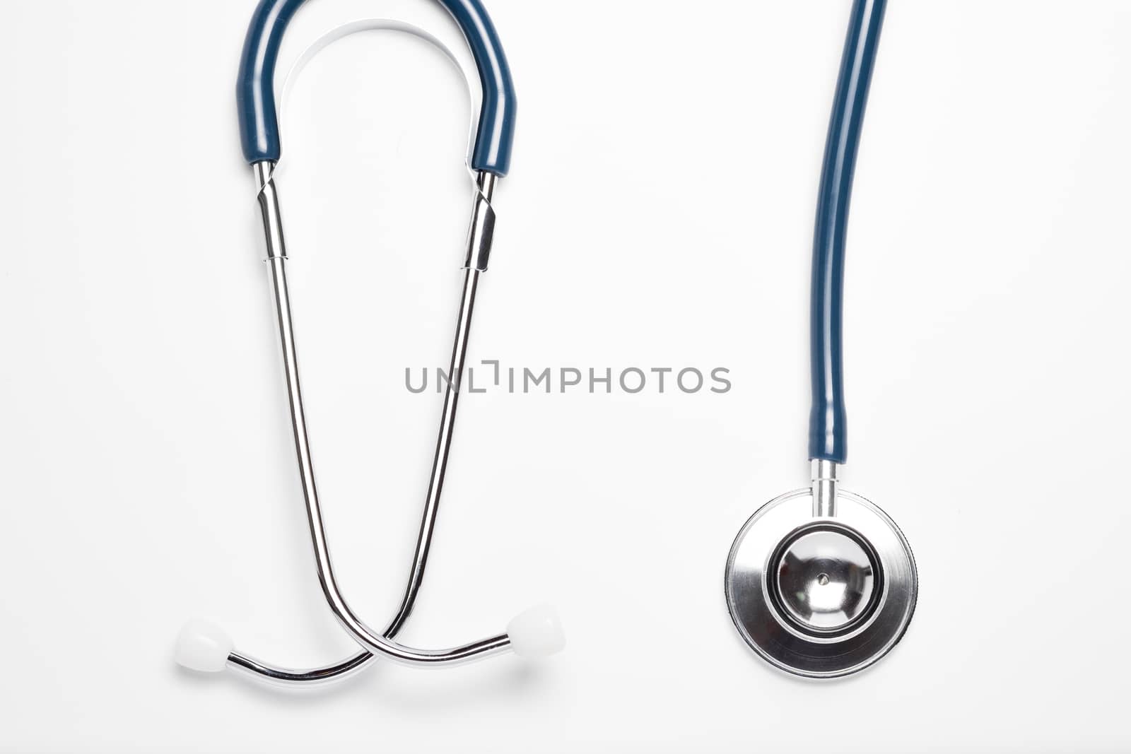 Blue stethoscope on white background by zneb076